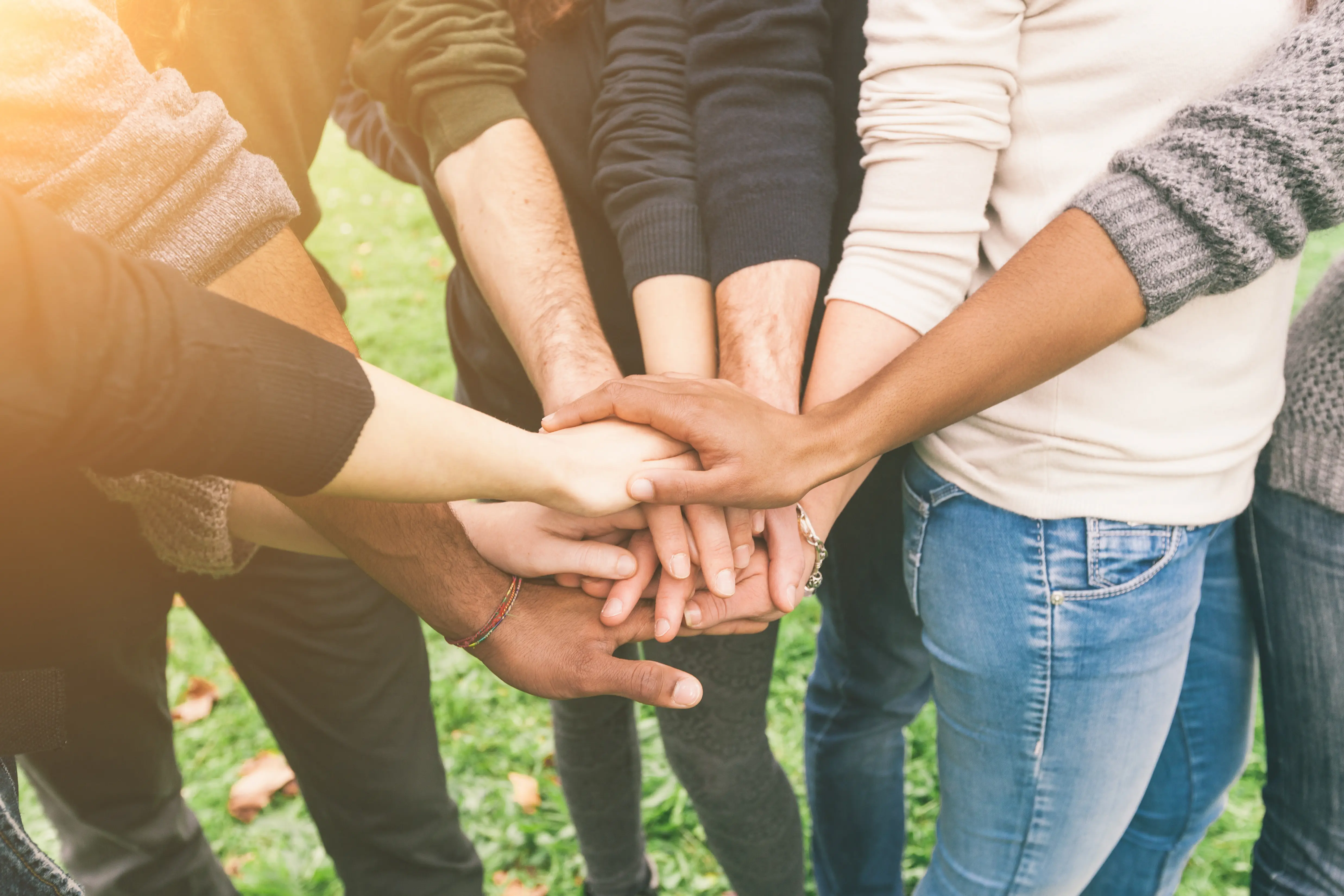 Multiracial Group of Friends with Hands in Stack, Teamwork